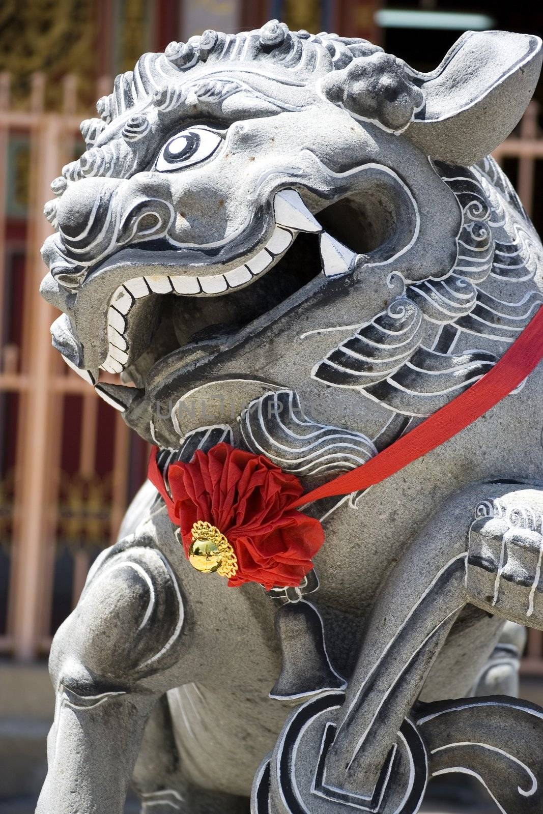 Image of a Chinese temple stone lion guardian in Malaysia.