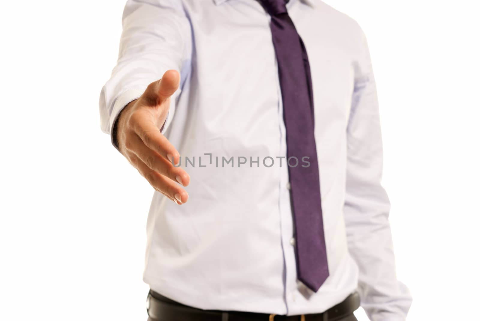 Unrecognizable businessman handshake closeup isolated on white background by dgmata
