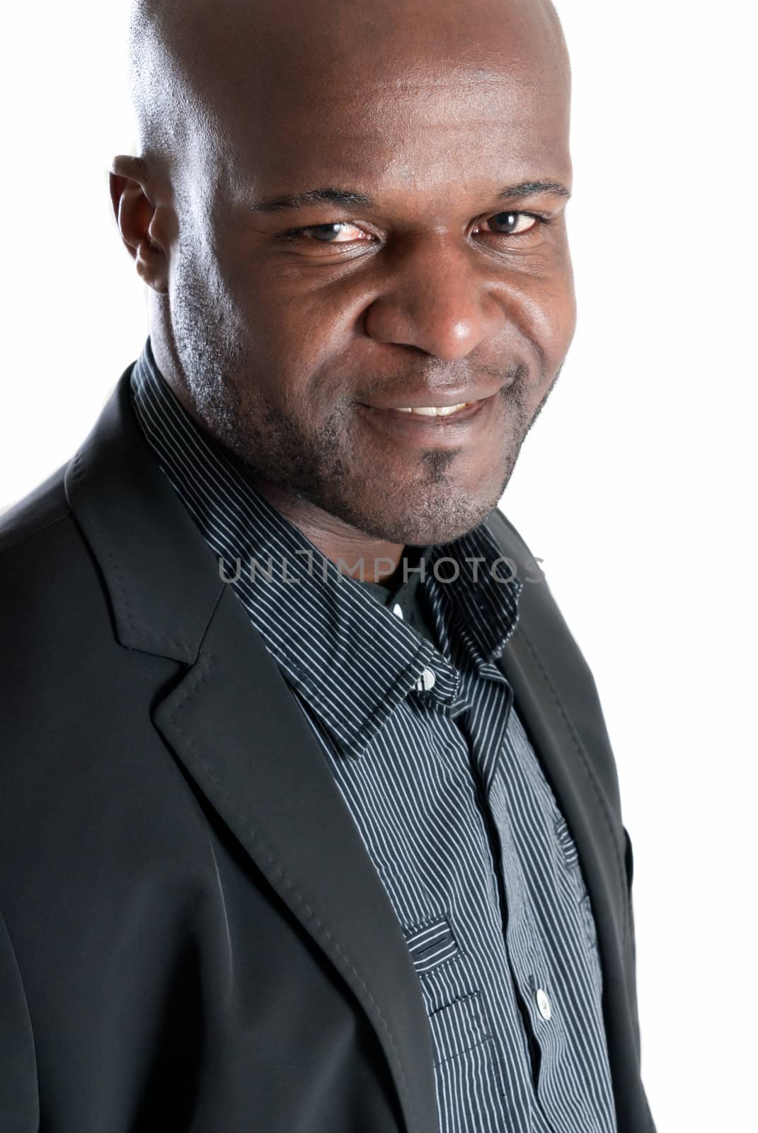 Happy black man portrait  well dressed smiling isolated on white background by dgmata