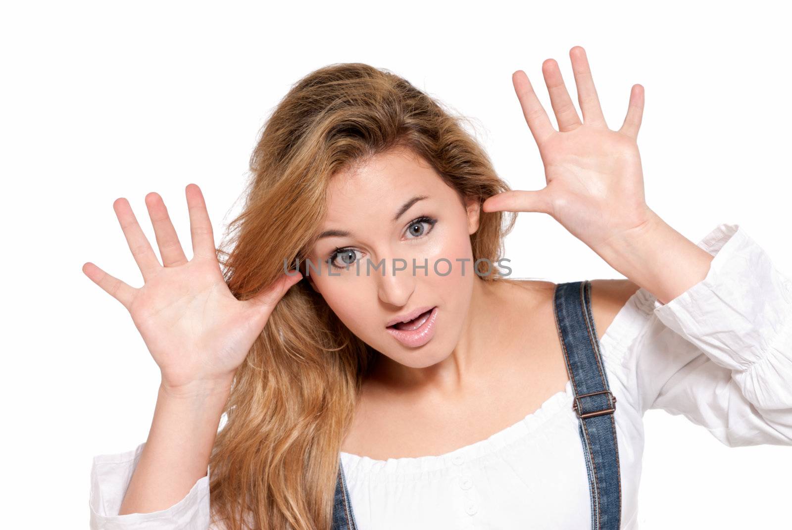 Young female cheerful joking with her hands isolated on white background by dgmata