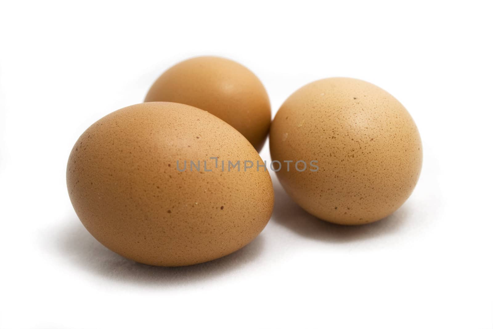 Three eggs on white background.