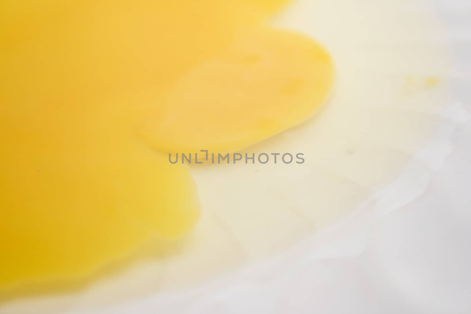 Egg yolk on a white plate.