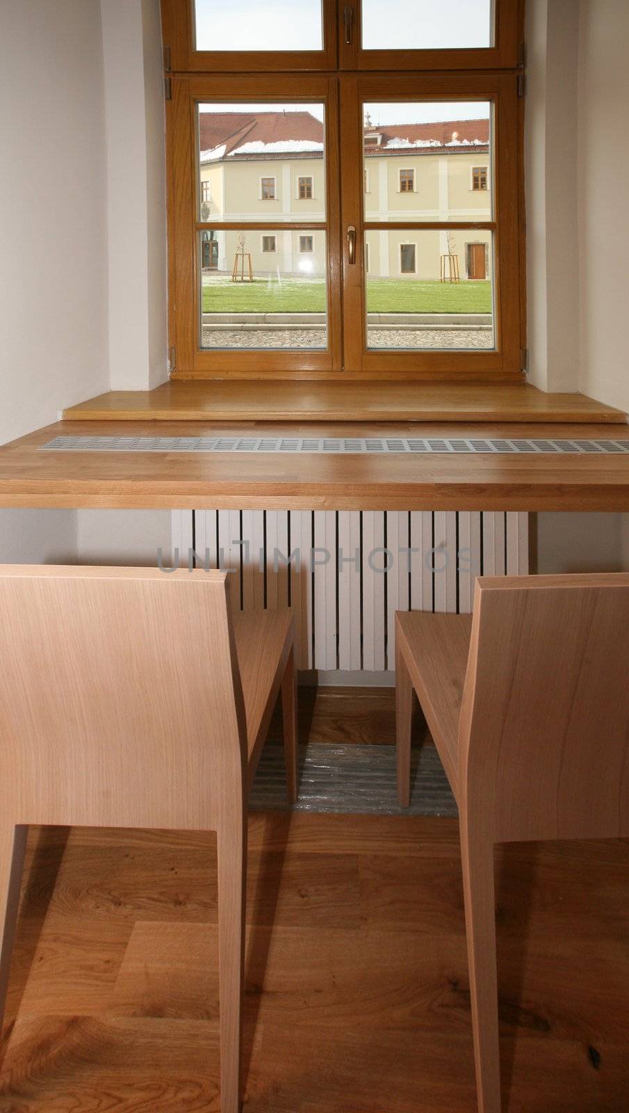 Wooden window with wooden table and chairs