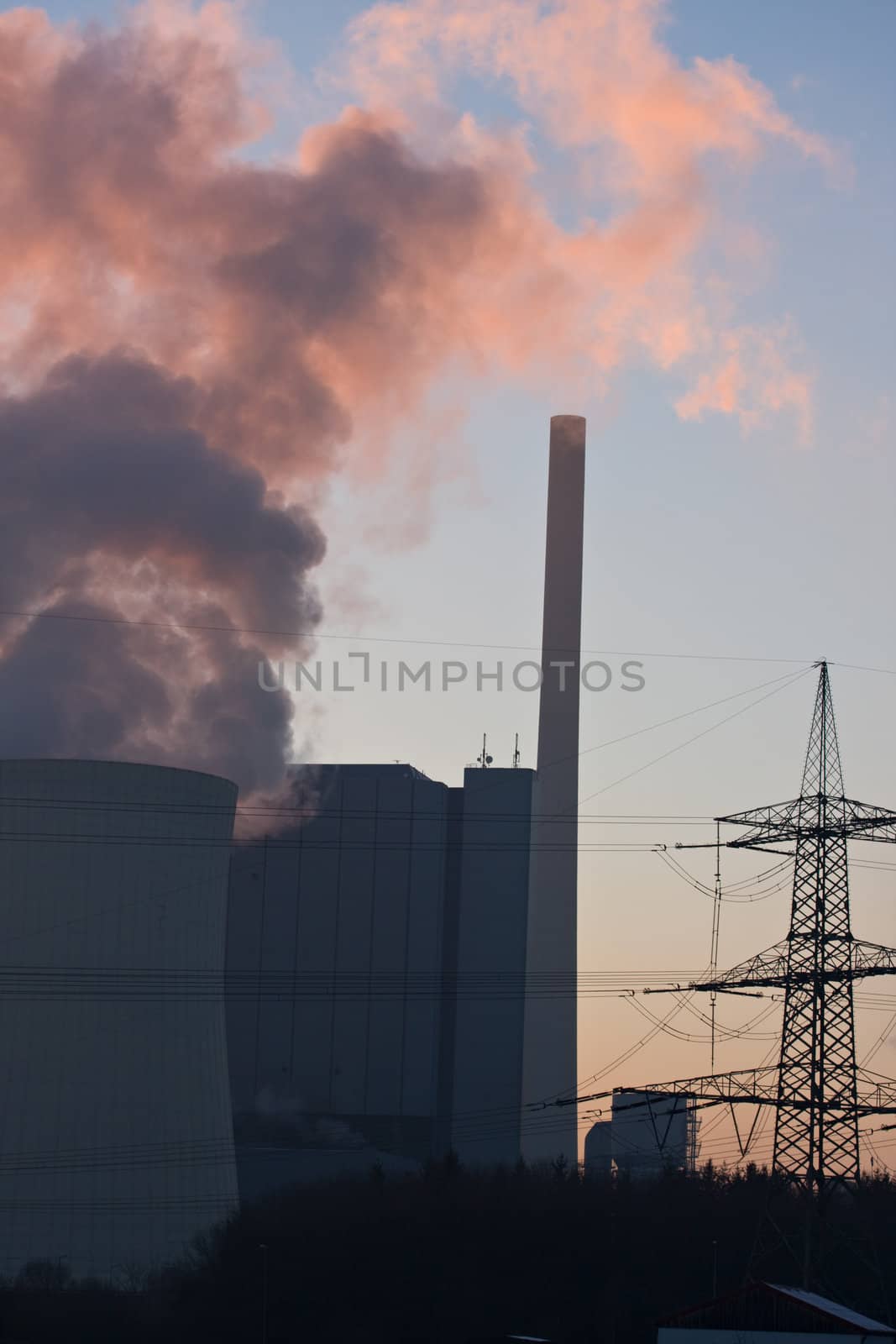 pink smoke from a power plant at sunset by bernjuer