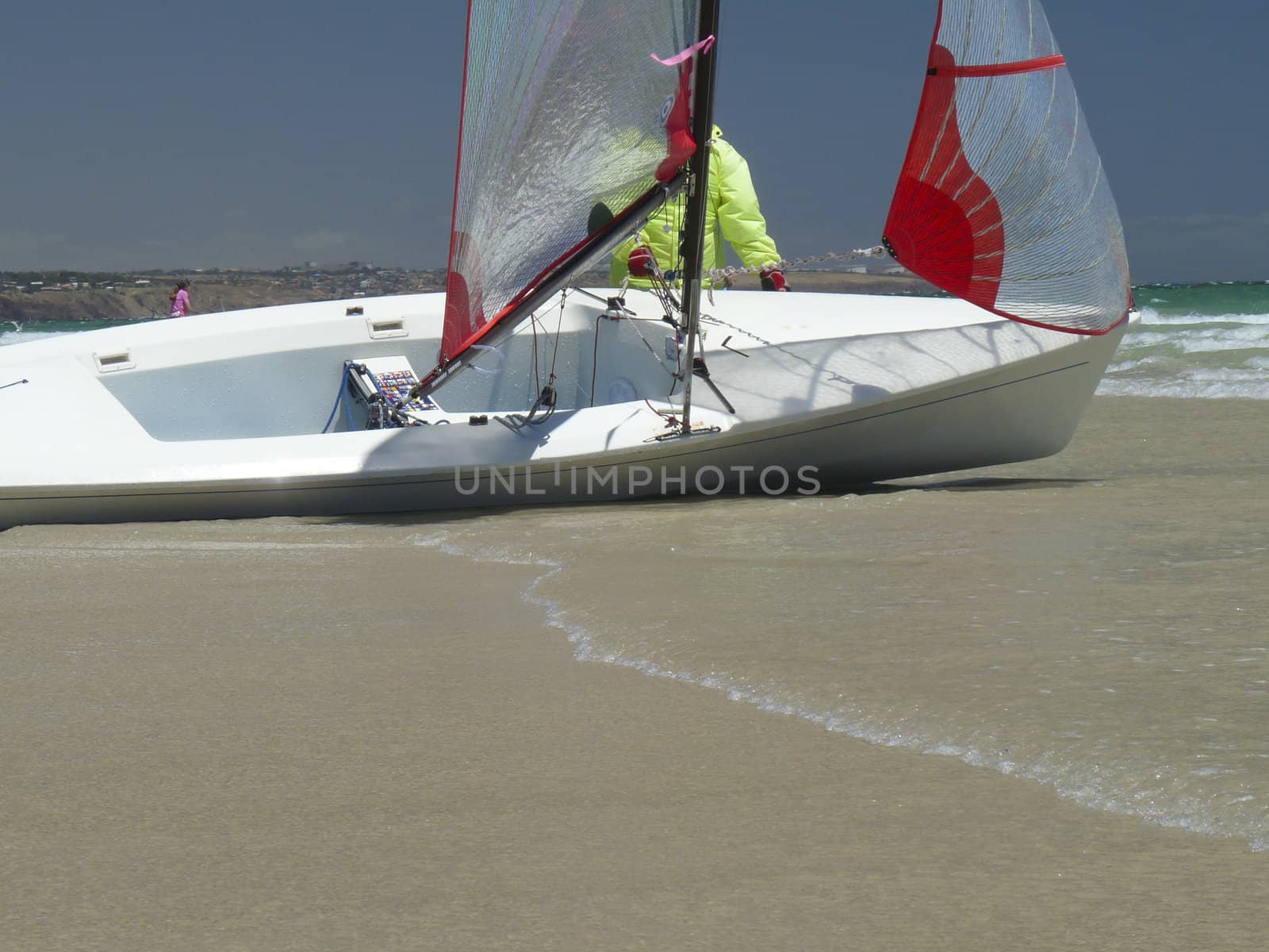 Sailor prepares beached yacht