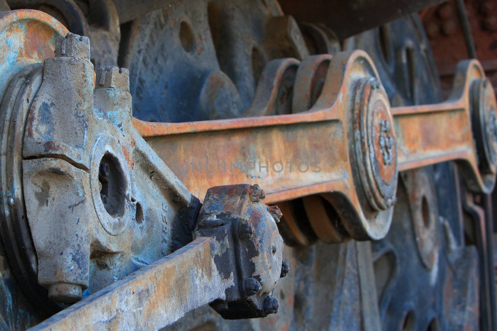 Close up of old rusted large train engine Train Coupling Rods