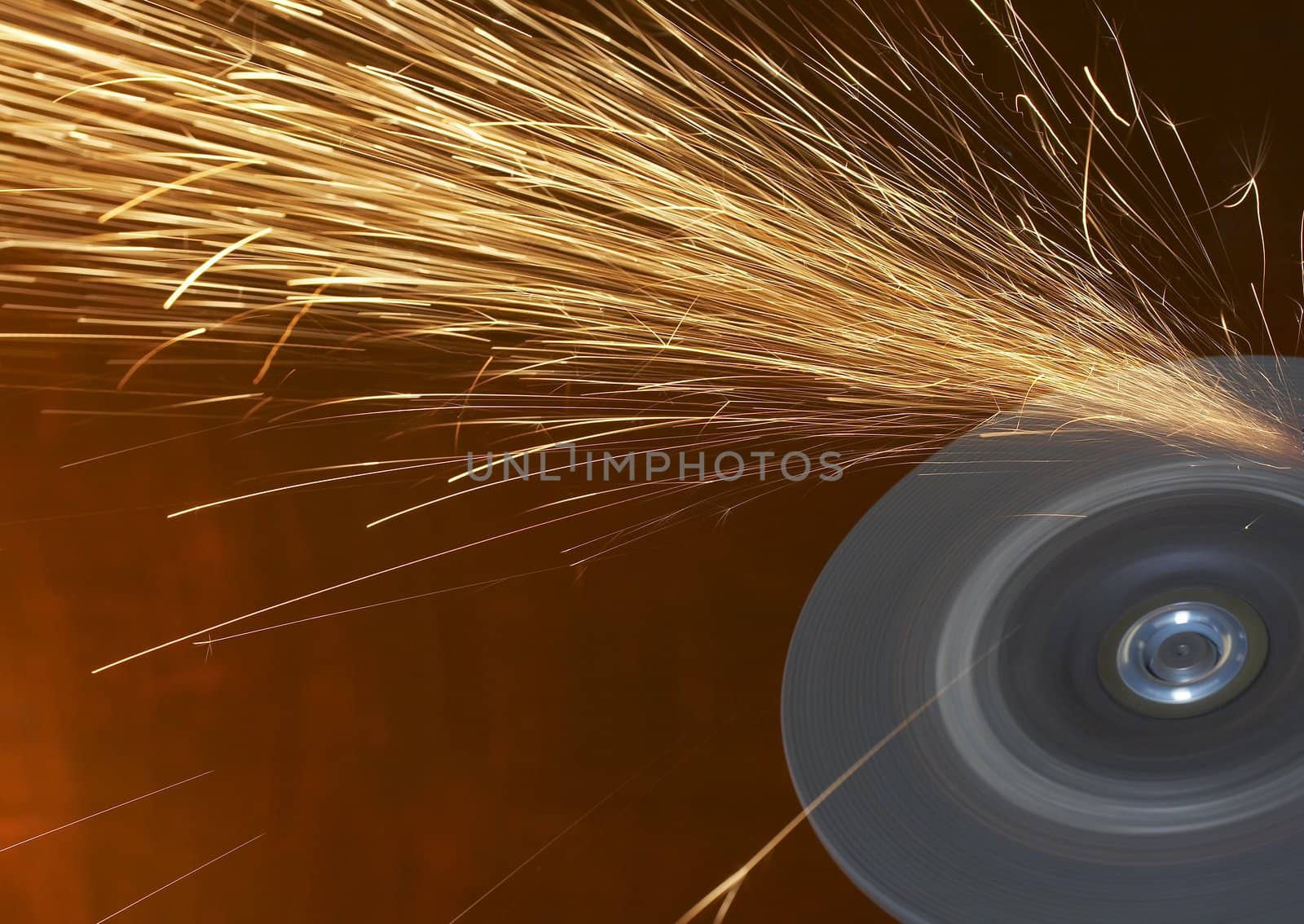 a close up picture of sparks on a grinding wheel