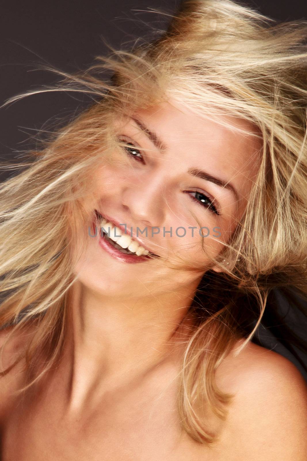 Gorgeous Blond Woman Fluttering Her Golden Hair