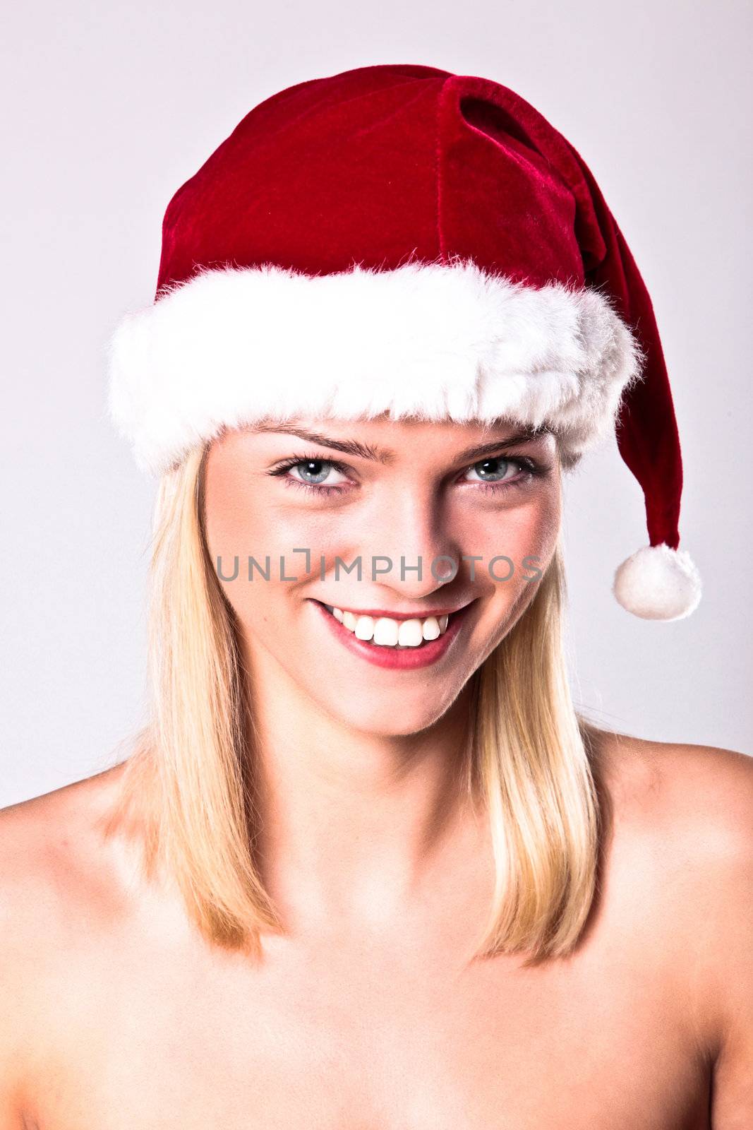 Portrait Of A Sexy Blond Girl Wearing A Santa Hat