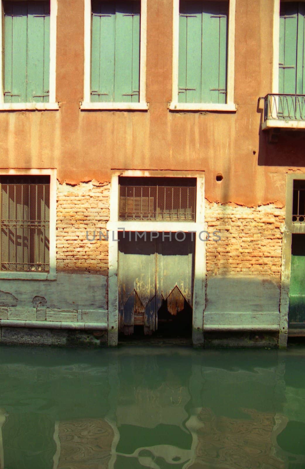 Door to house on canal in Venice Italy