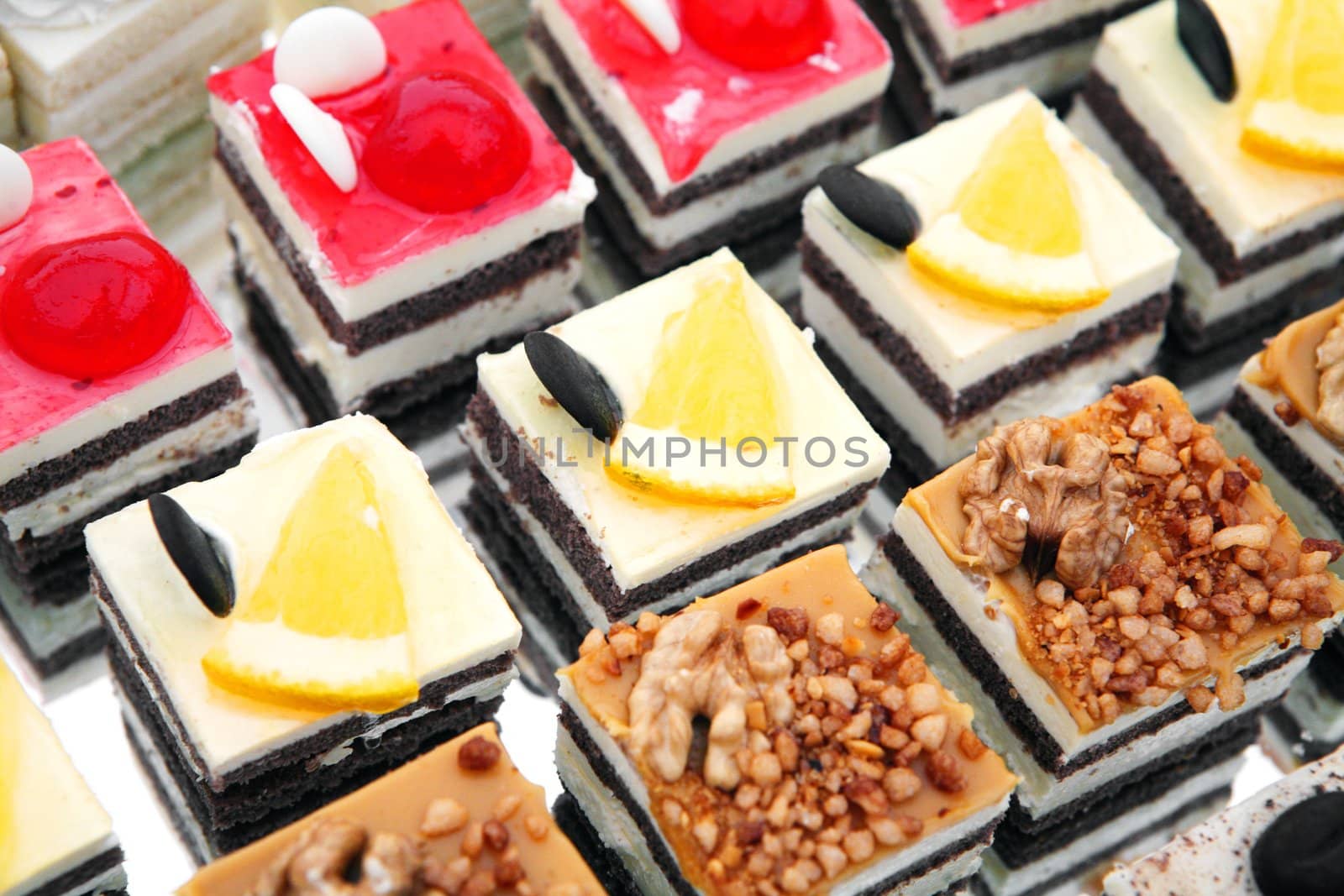 Colorful small fruity and chocolate dezerts