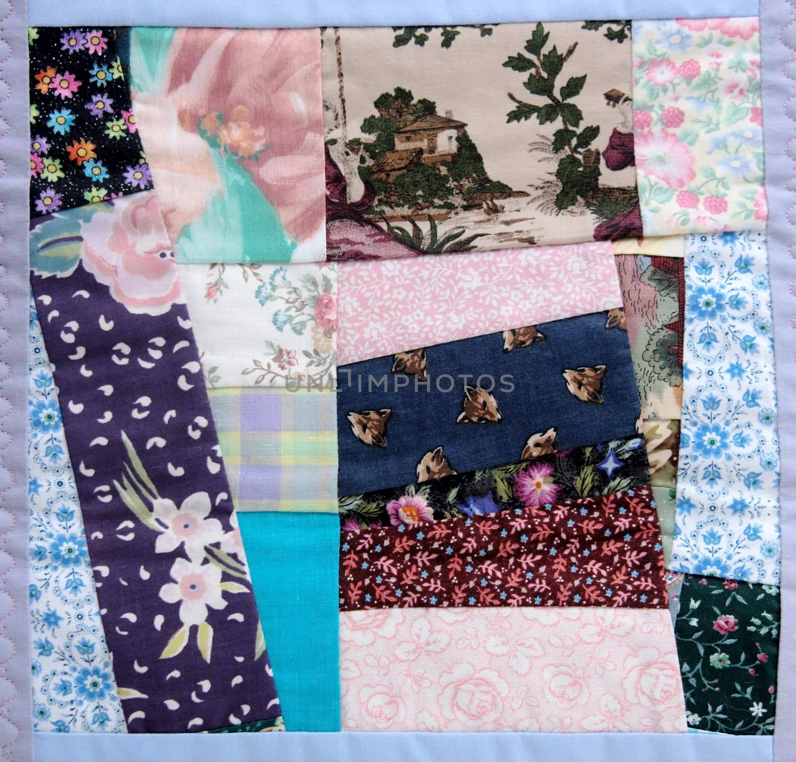 a portion of a crazy quilt with various floral and print fabrics