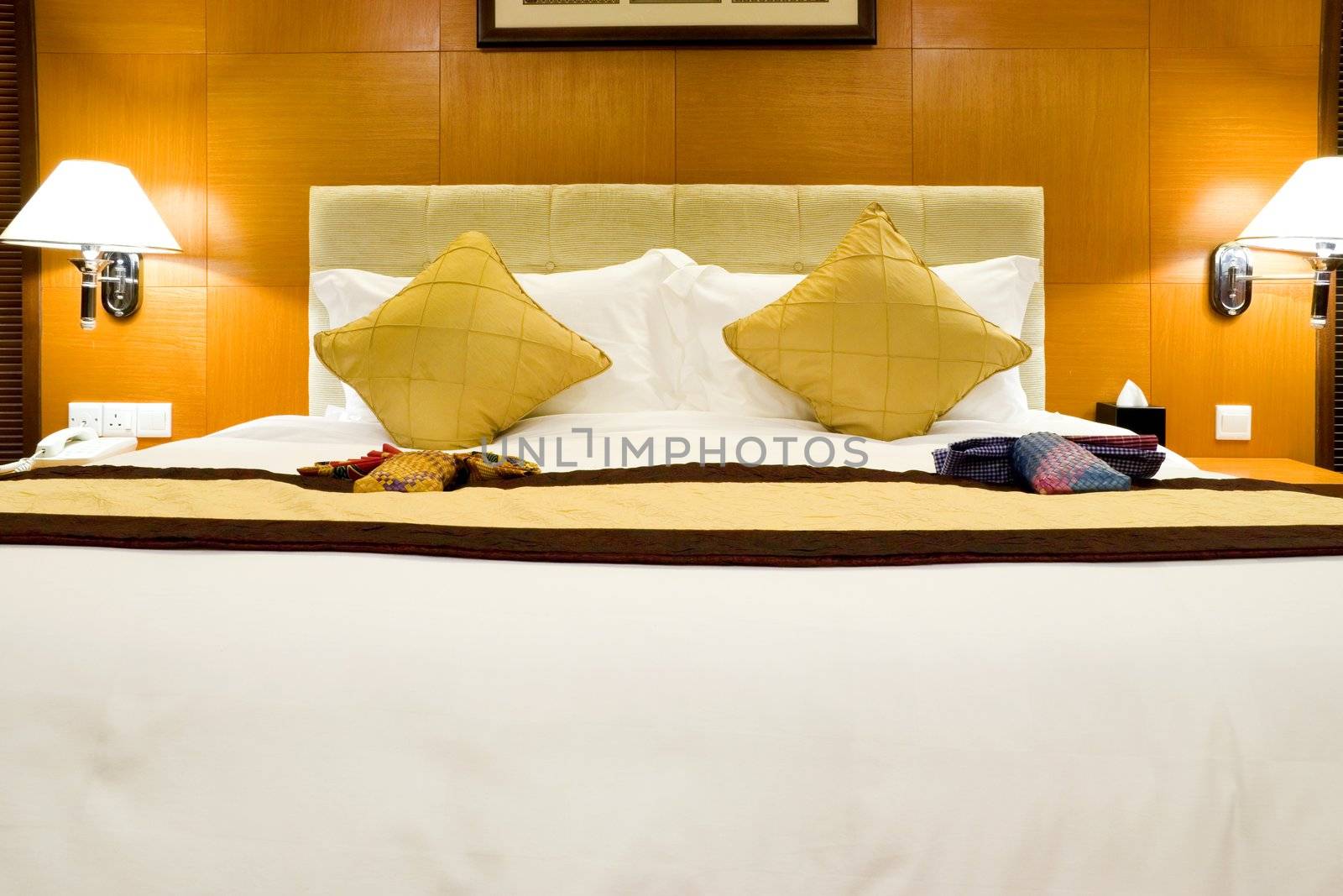 Image of a comfortable looking hotel bed.