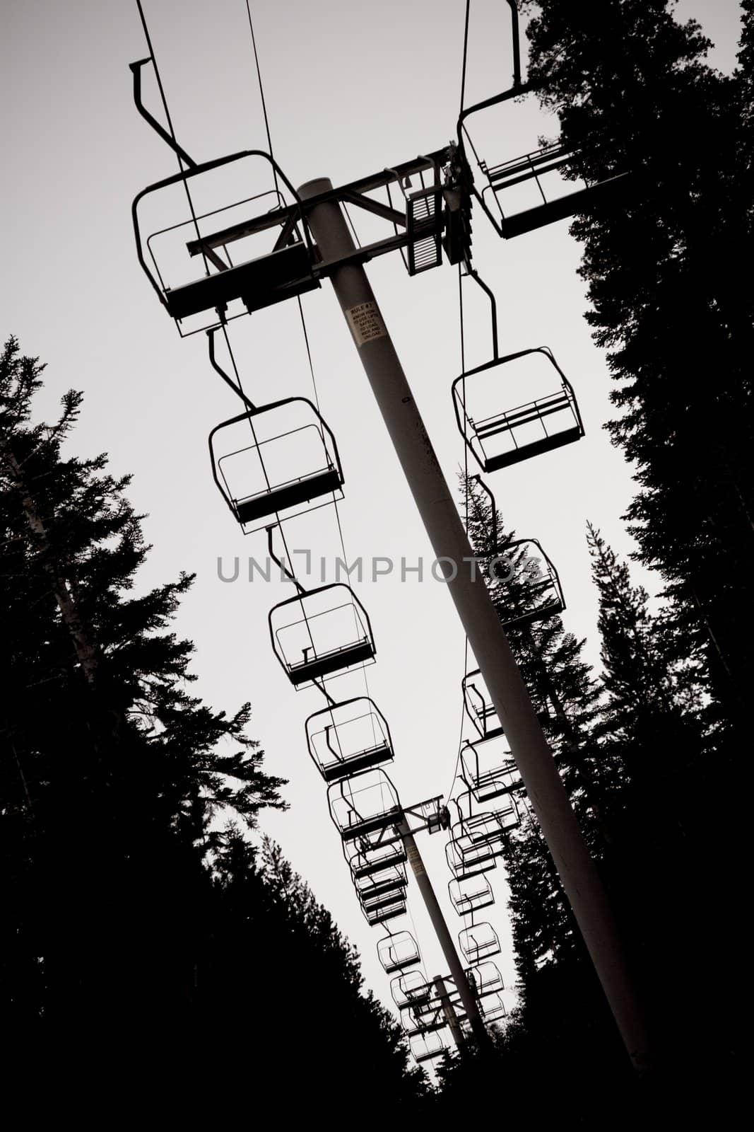 Silhouette of idle ski lift