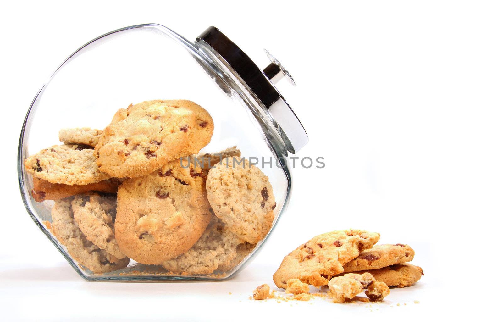 Glass  jar with cookies against a white background