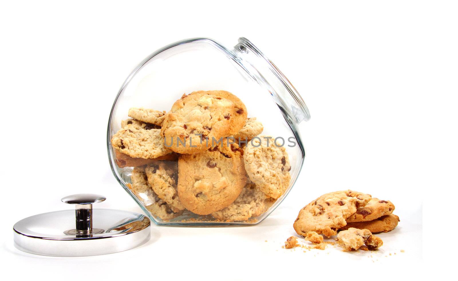 Homemade cookies in glass jar on white background