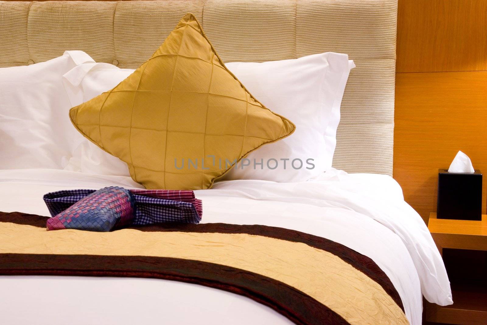 Image of a comfortable looking hotel bed.