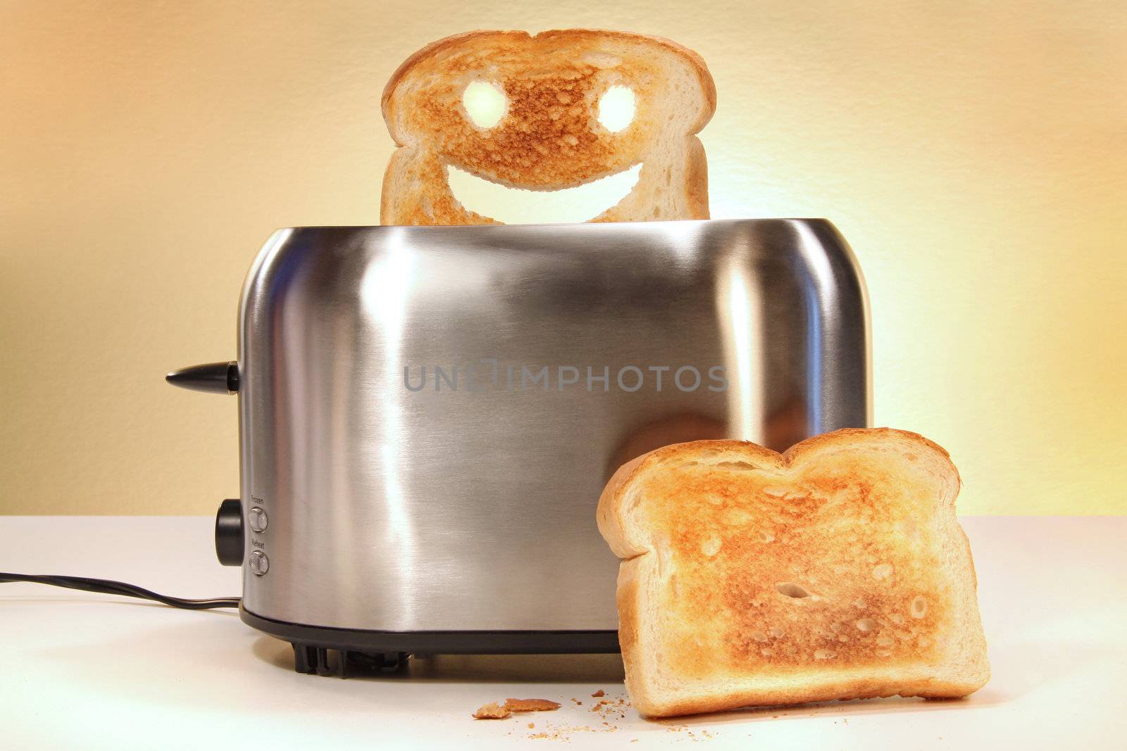 Toaster with two slices of bread on kitchen counter