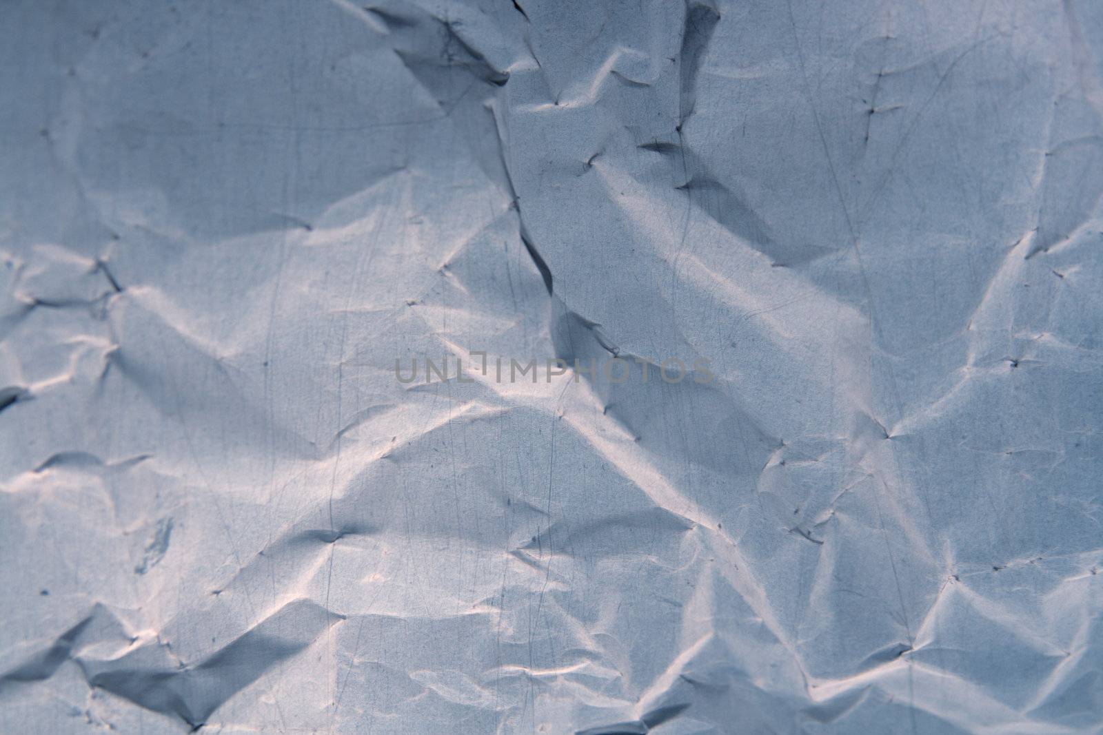 crumpled paper with lines and irregular marks