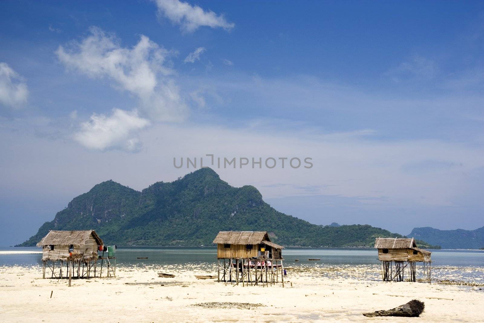 Image of island native huts on a remote island in Malaysia.