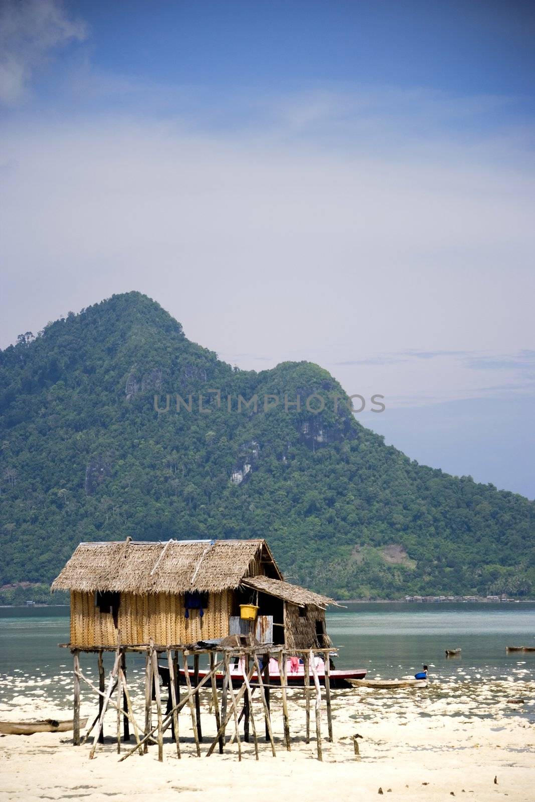 Image of a native hut on stilts on a remote island in Malaysia.