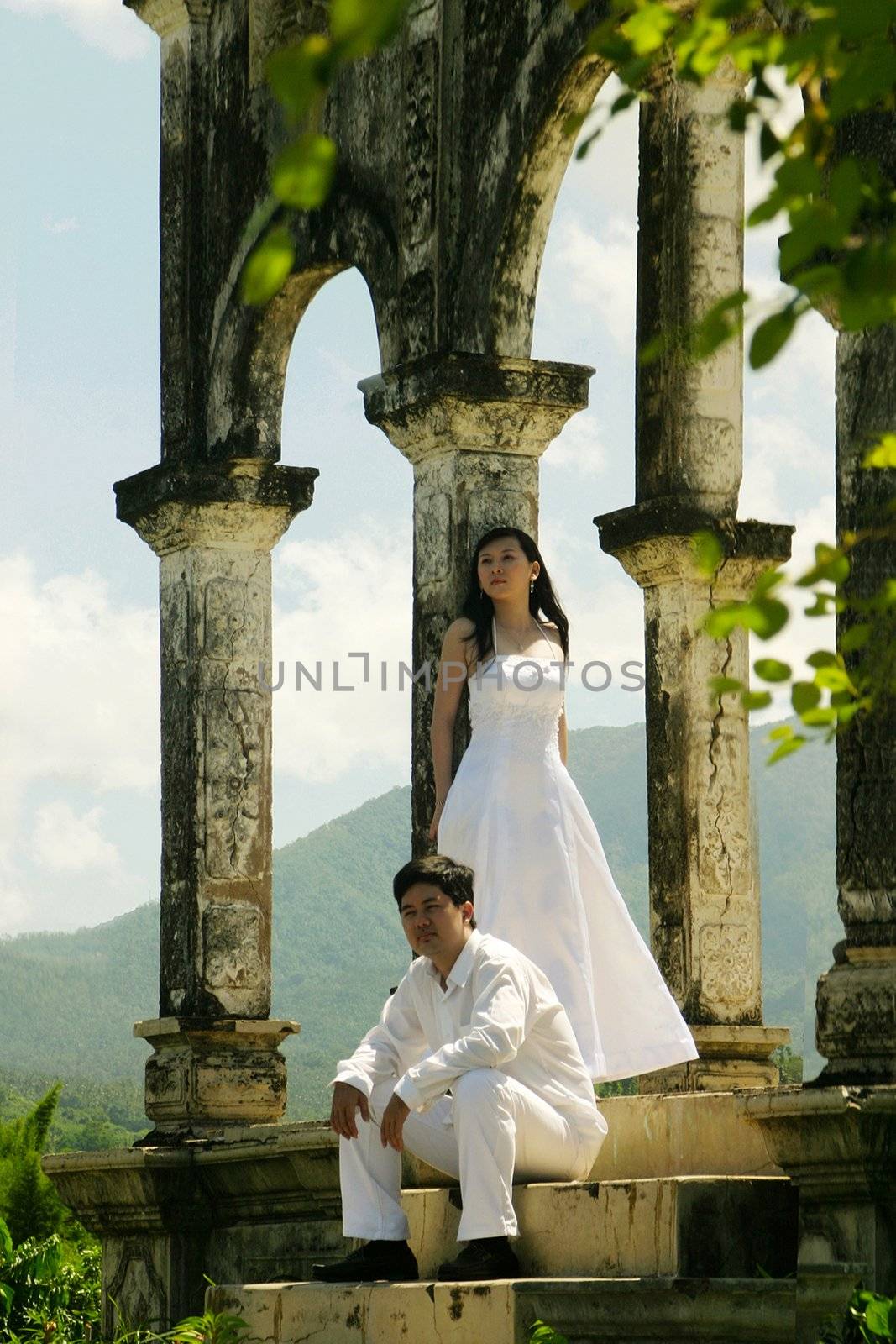 Couple in white in an old building