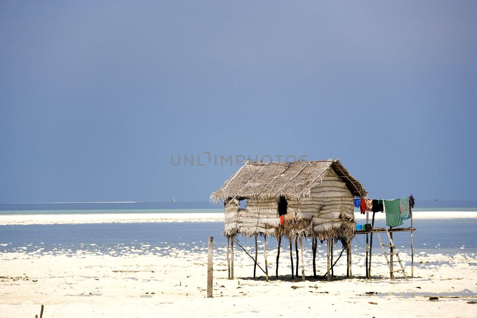 Image of a native hut on stilts.