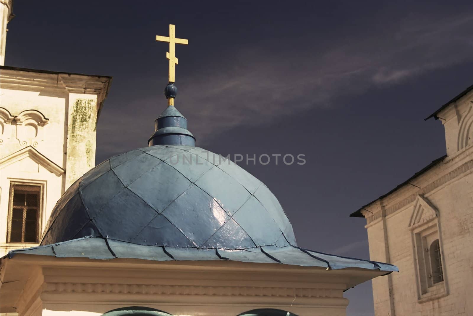 Blue roof of small Russian church against a blue sky