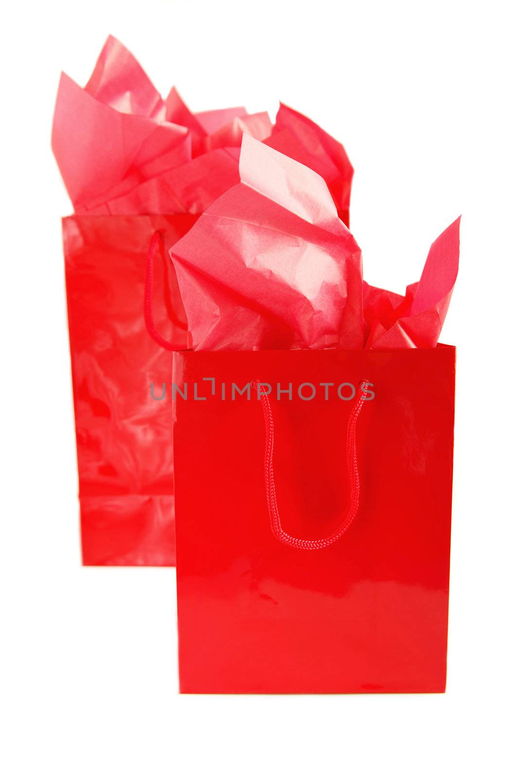 Two red shopping bags isolated on white background