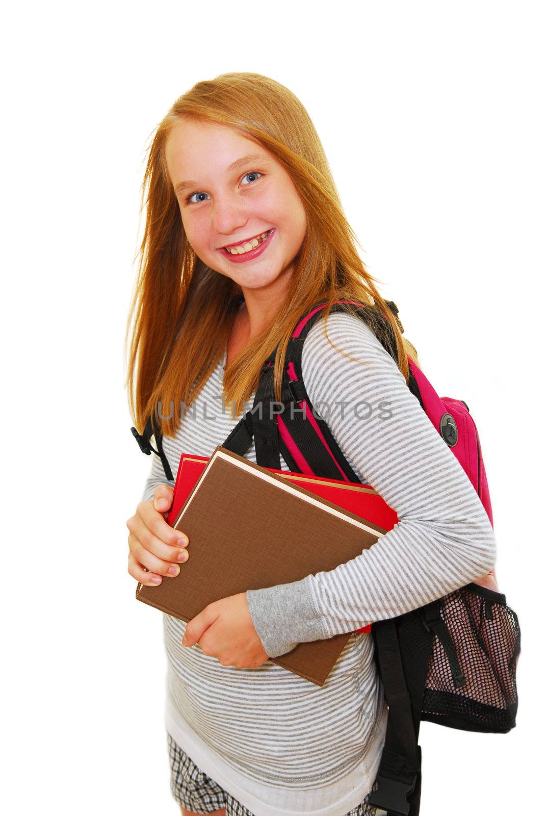 Young smiling school girl with backpack and books isolated on white background