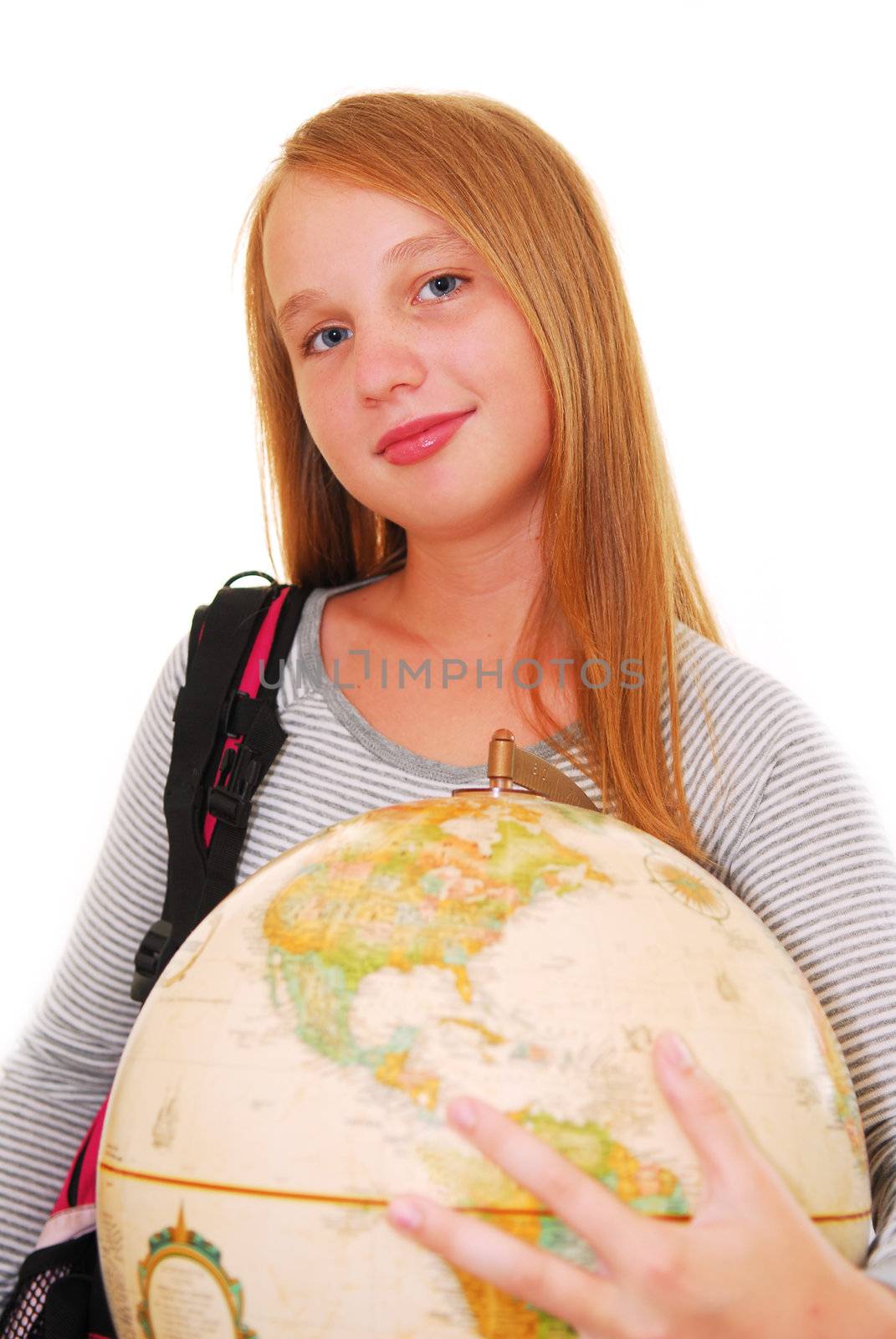 Young smiling girl with a backback and a globe isolated on white background