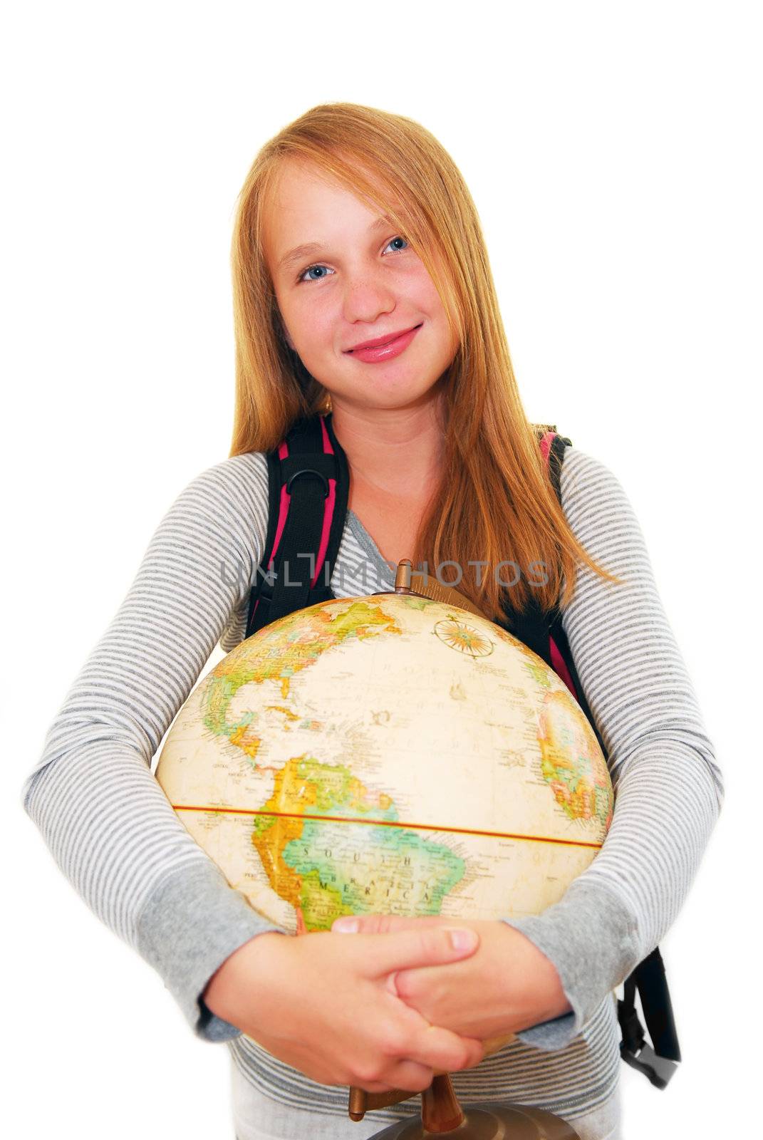 Young smiling school girl with a backback and a globe isolated on white background