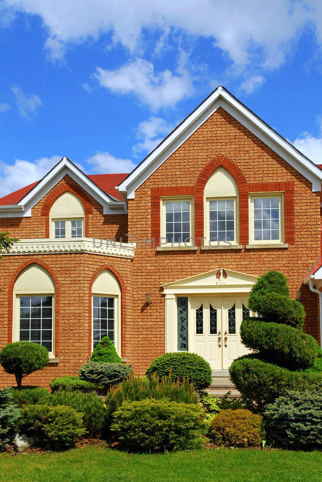 Residential house with beautiful landscaping in front yard