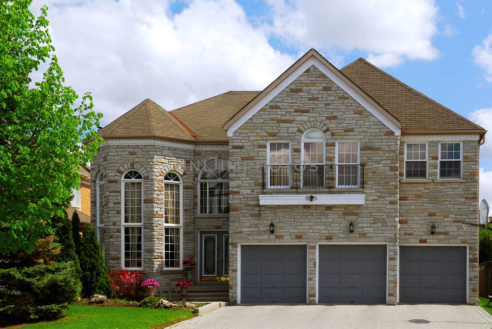 Big luxury residential house with natural stone facing