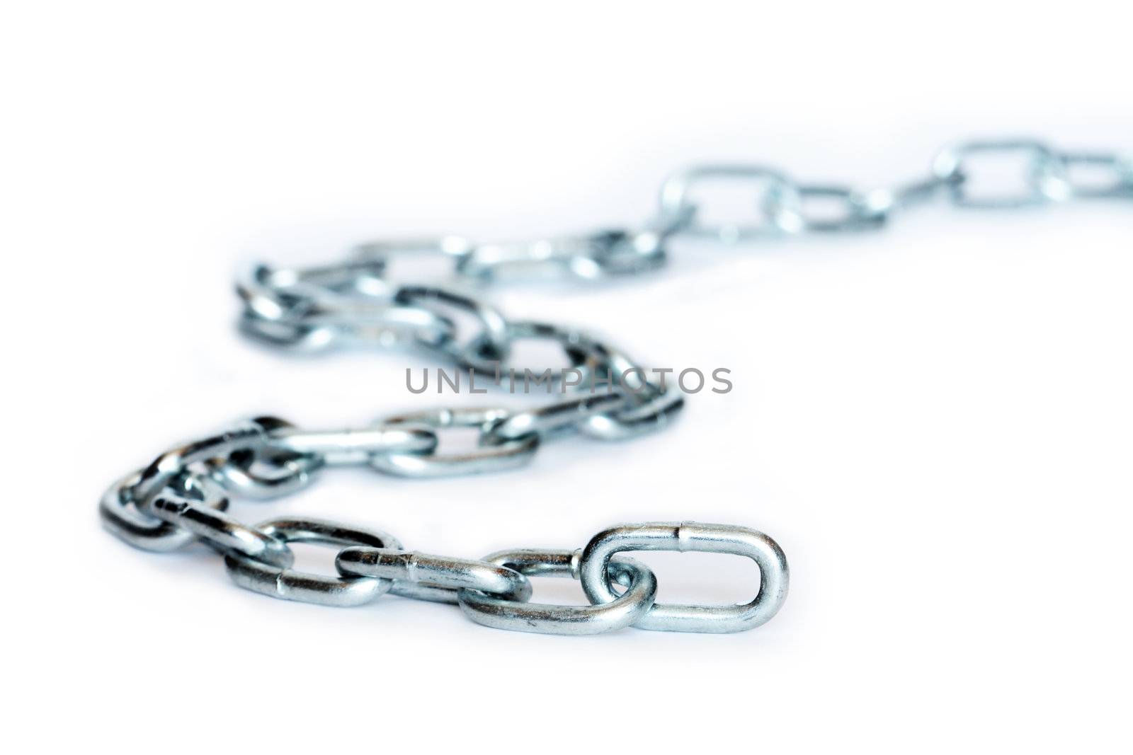 Closeup of long metal chain on white background