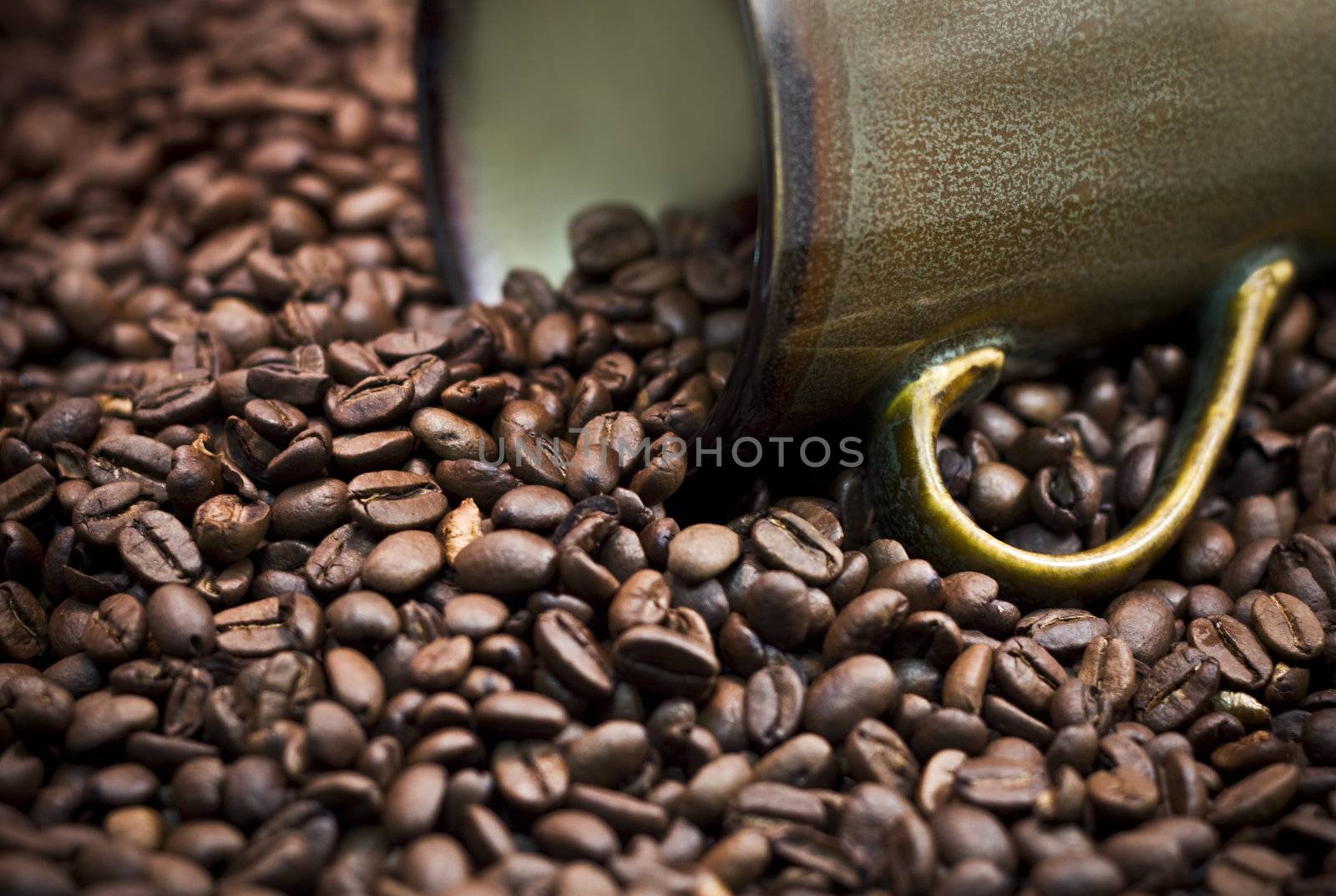 Coffee Beans spilling from a cup. by StephanieFrey