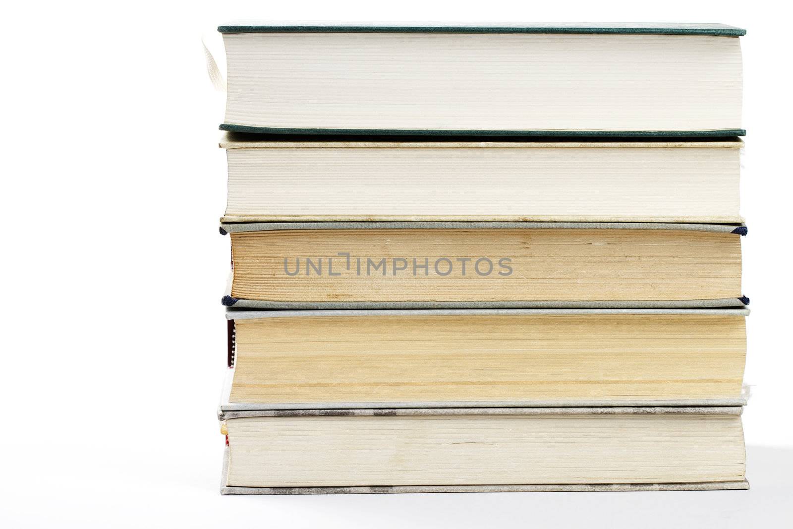 a stack of five books on white background