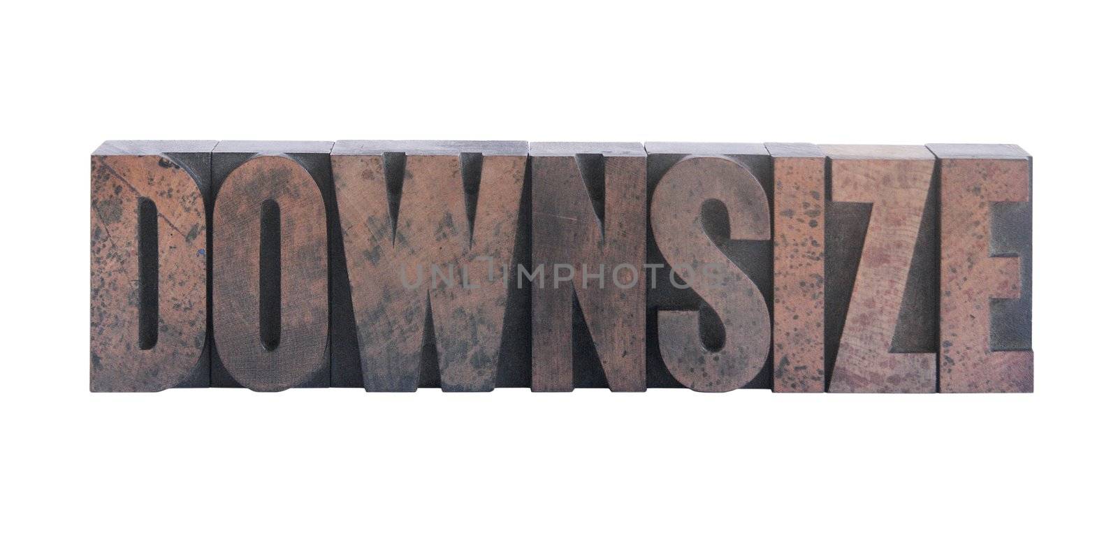 the word 'downsize' in old ink-stained wood type