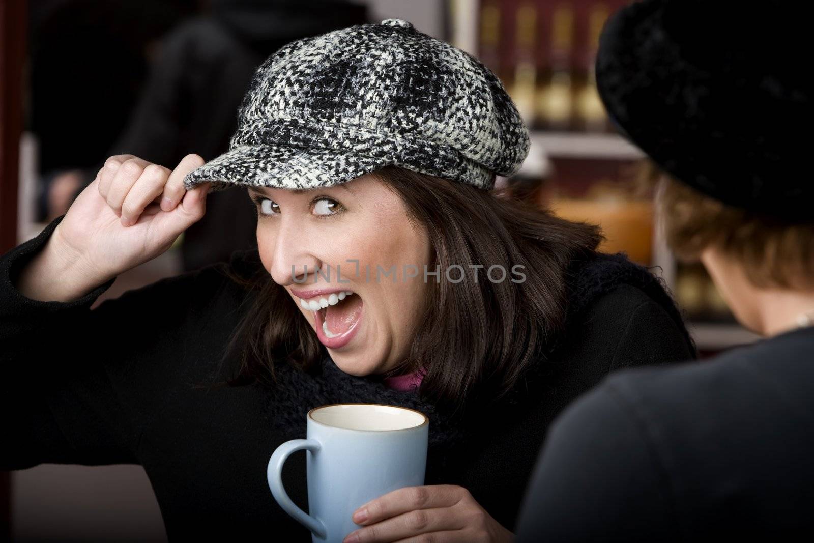 Pretty Hispanic woman with coffee and a big smile