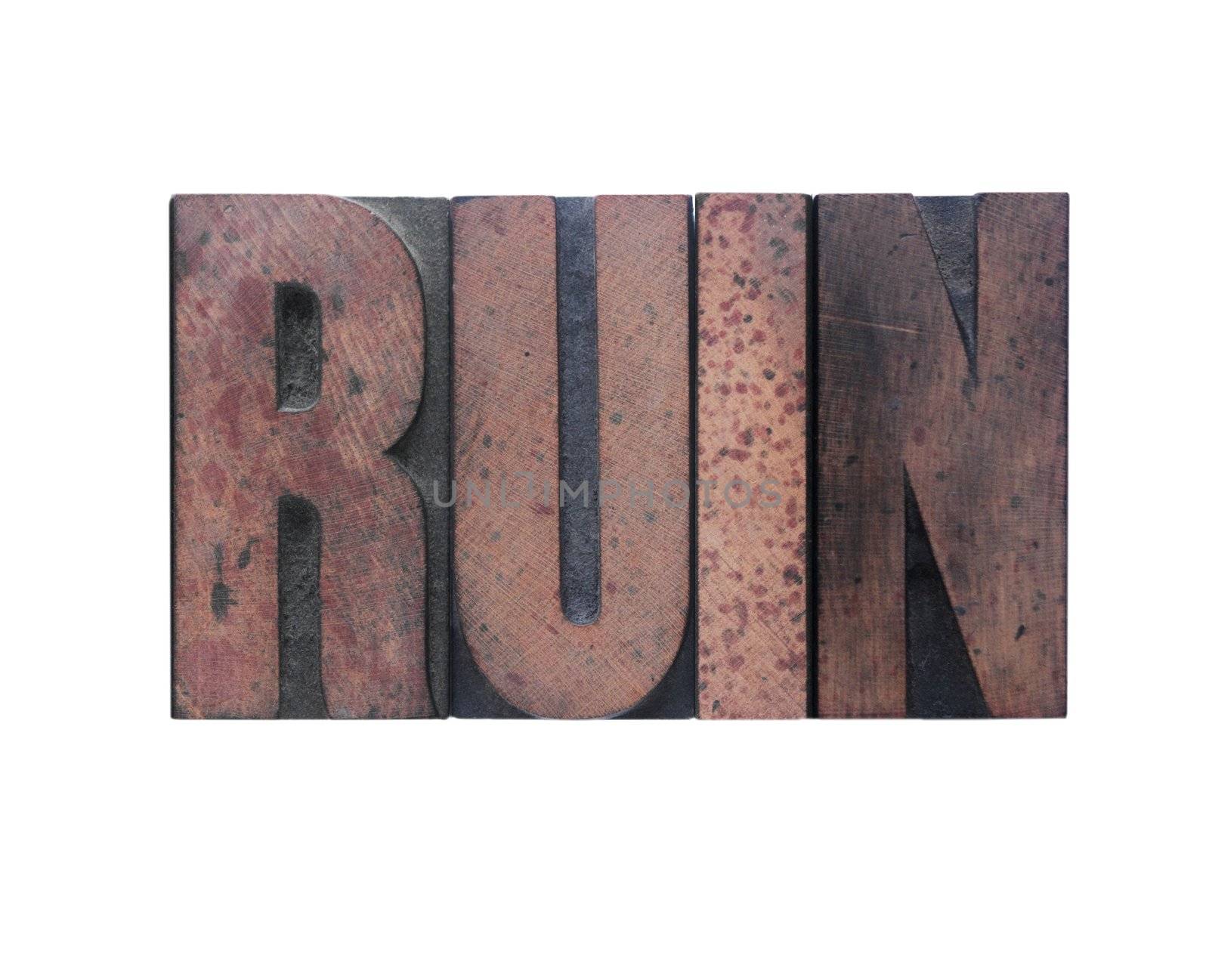 the word 'ruin' in old ink-stained wood type 