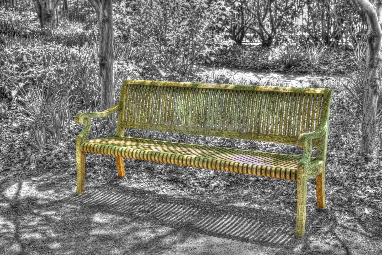 A bench in a city park, shot in HDR