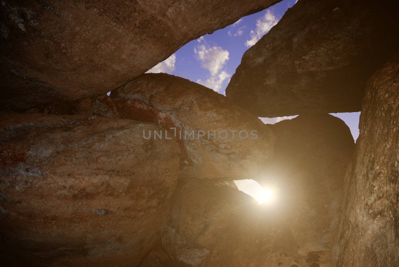 Sun seen through the hole between rocks in Pinnacles, National Park in California.