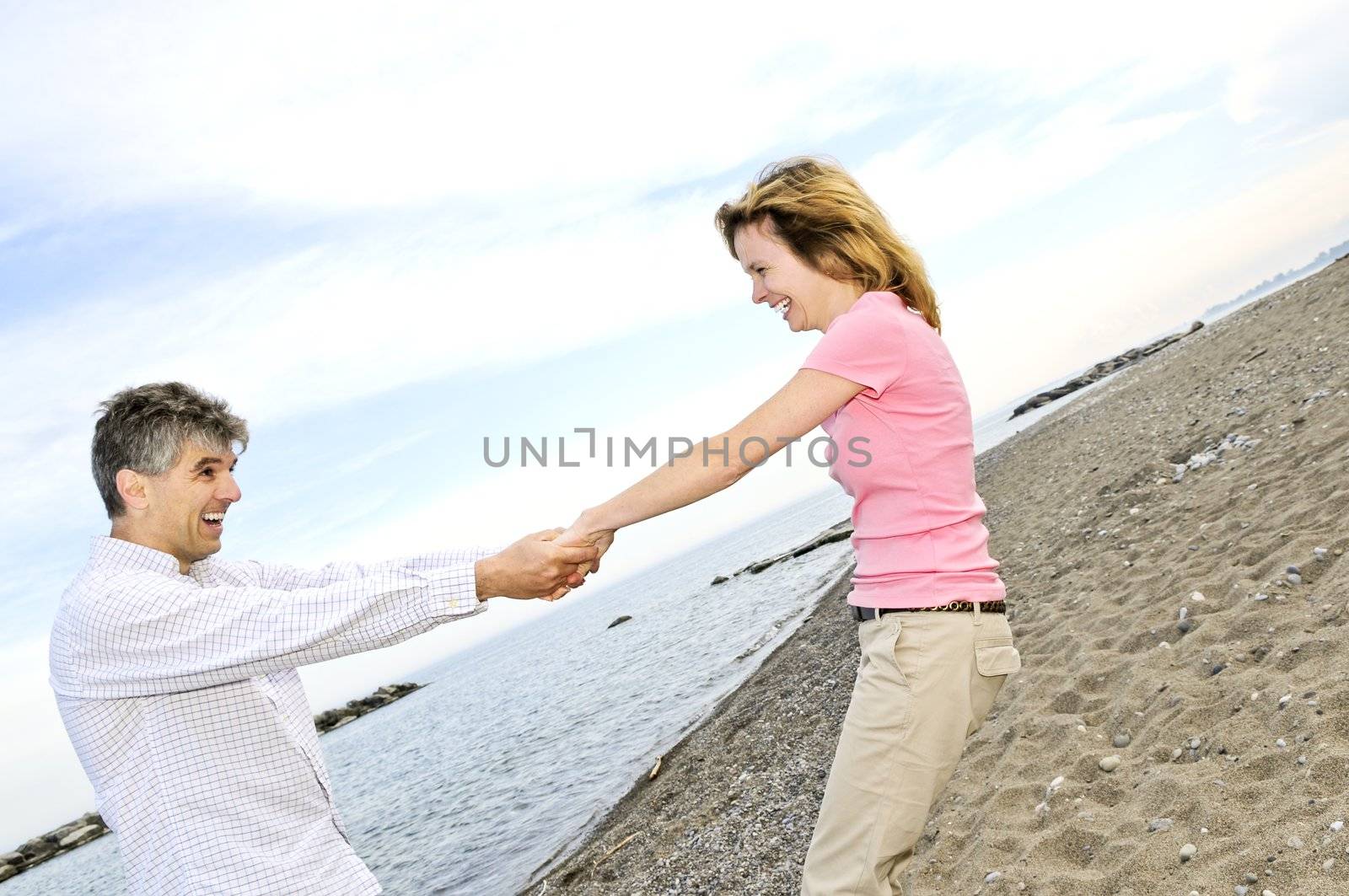 Mature romantic couple having fun on a beach