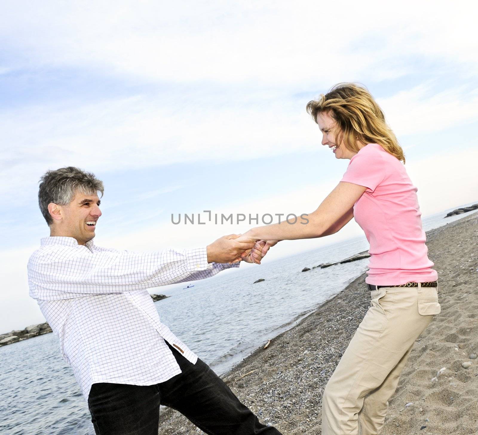 Mature romantic couple having fun on a beach