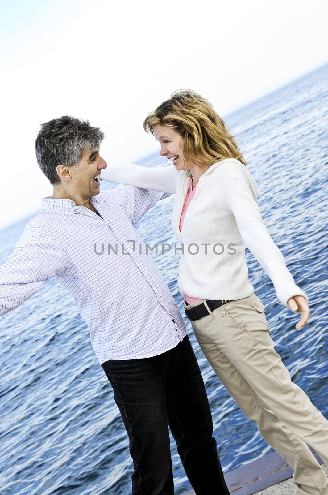 Carefree mature couple by elenathewise