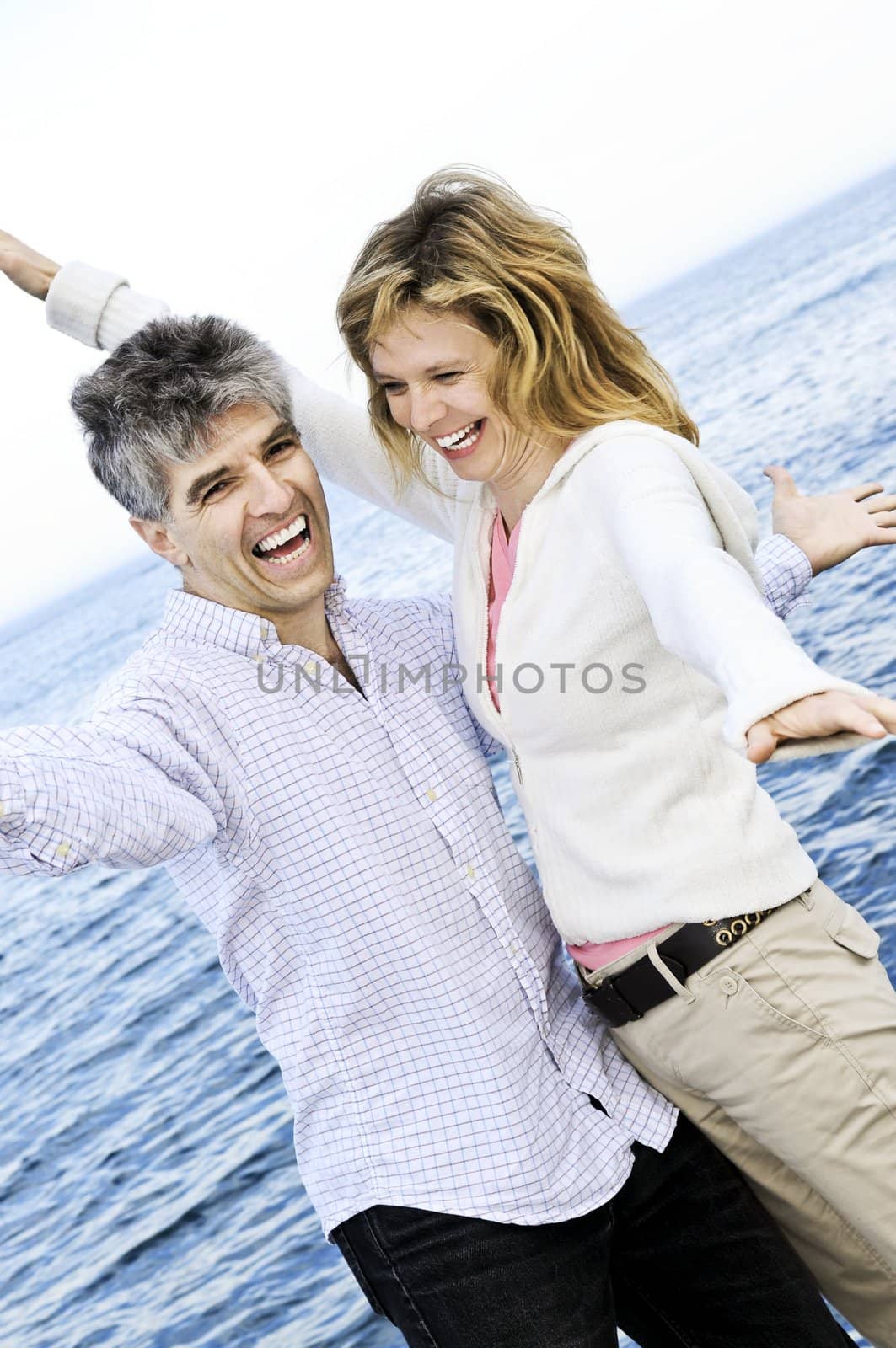 Carefree mature couple by elenathewise