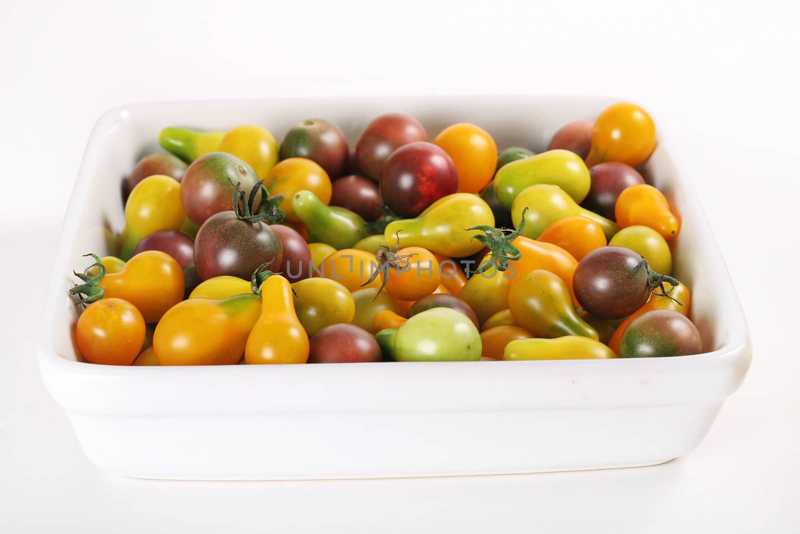 baby organic heirloom tomatoes by creativestock