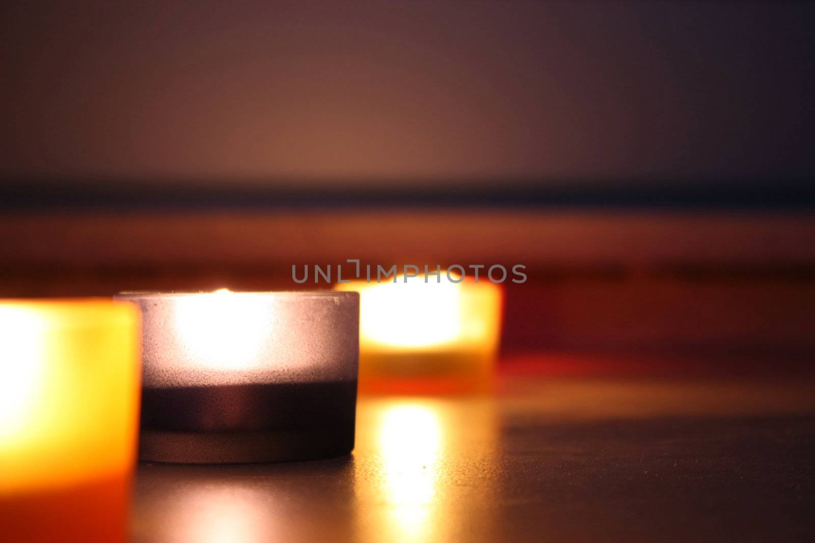 Set of relaxing atmosphere by candle lights over a dark background