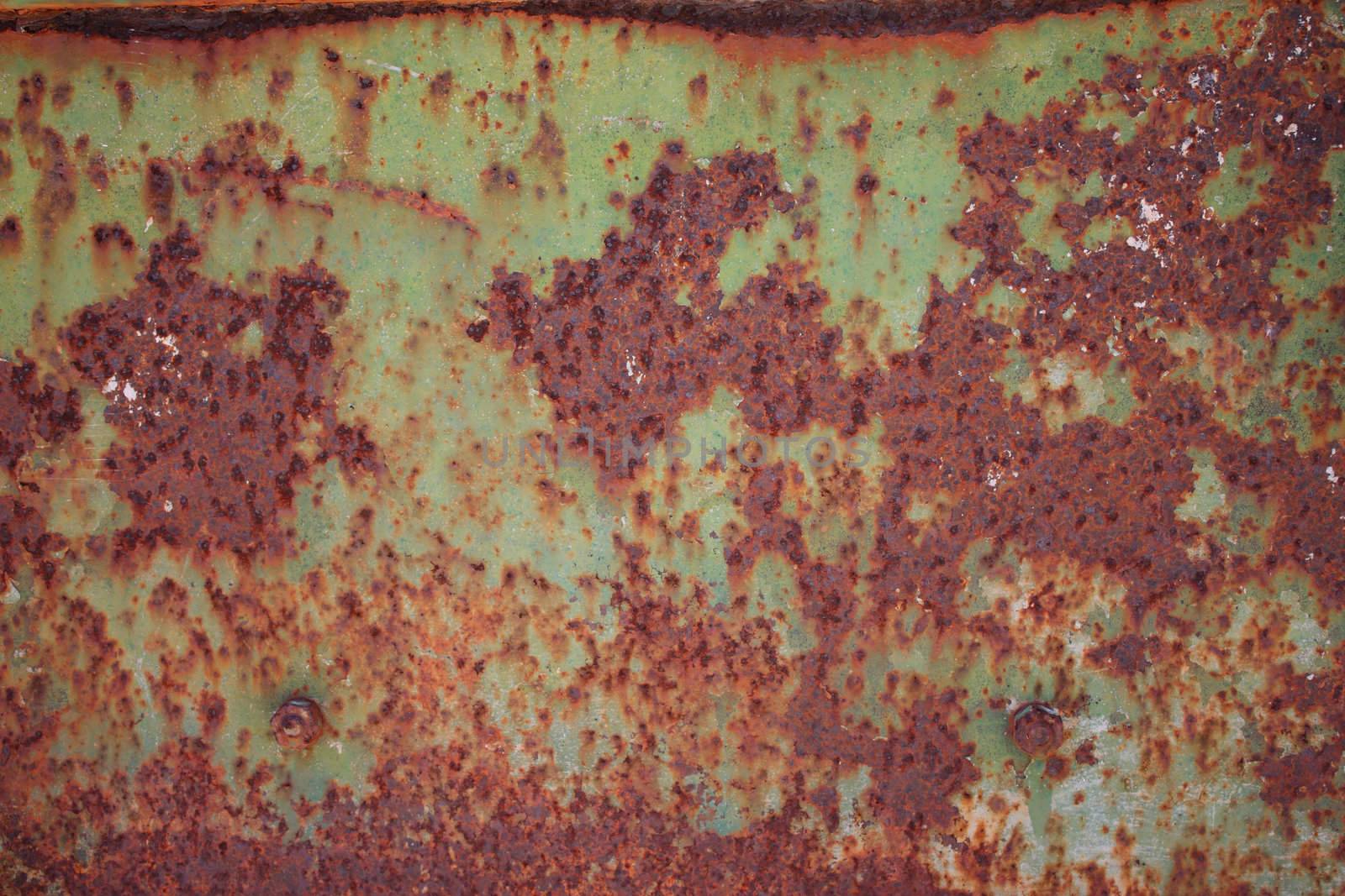 Rusty painted metal with paint pilling off