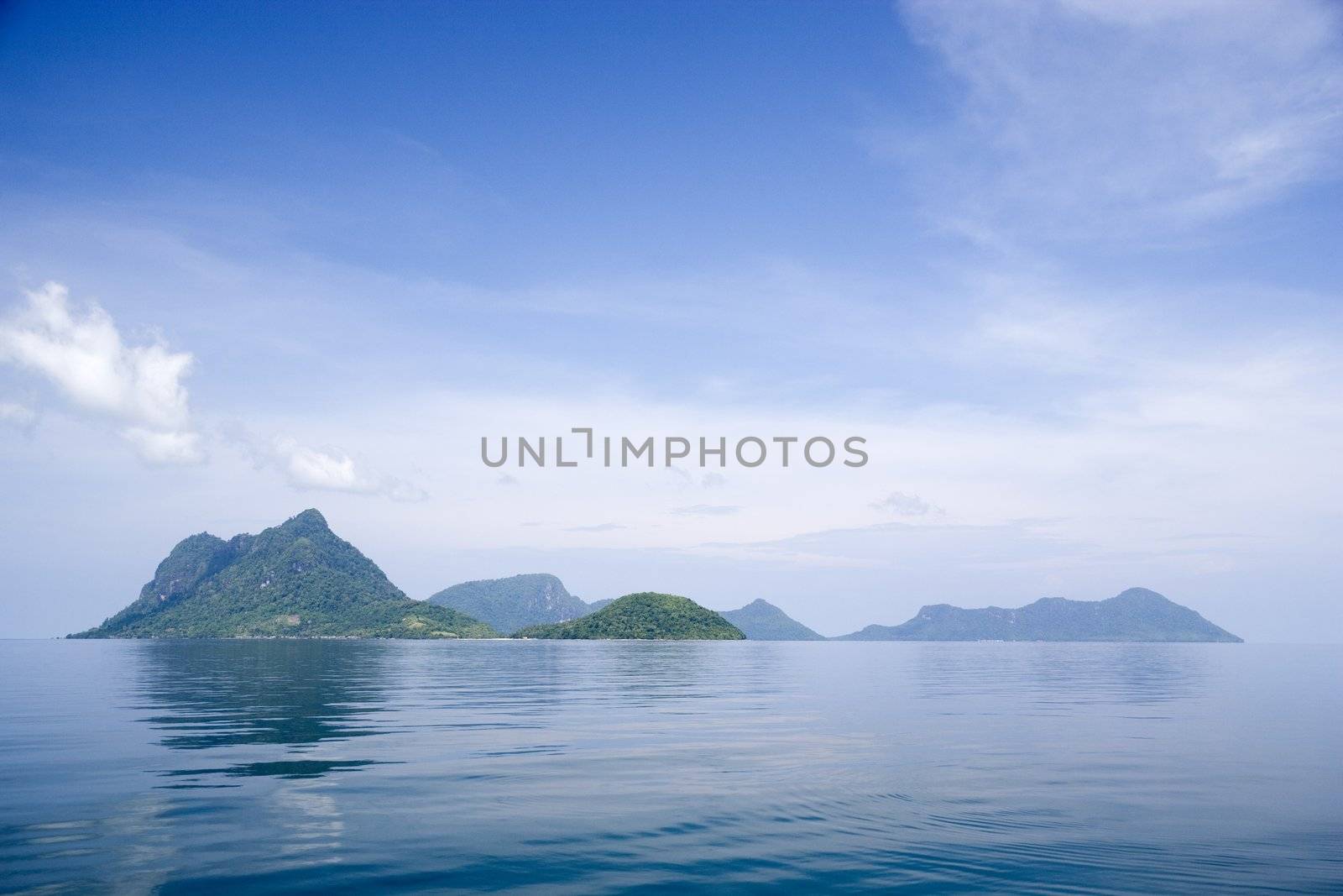 Image of remote Malaysian tropical islands that were formerly the rim of a volcano, now extinct.